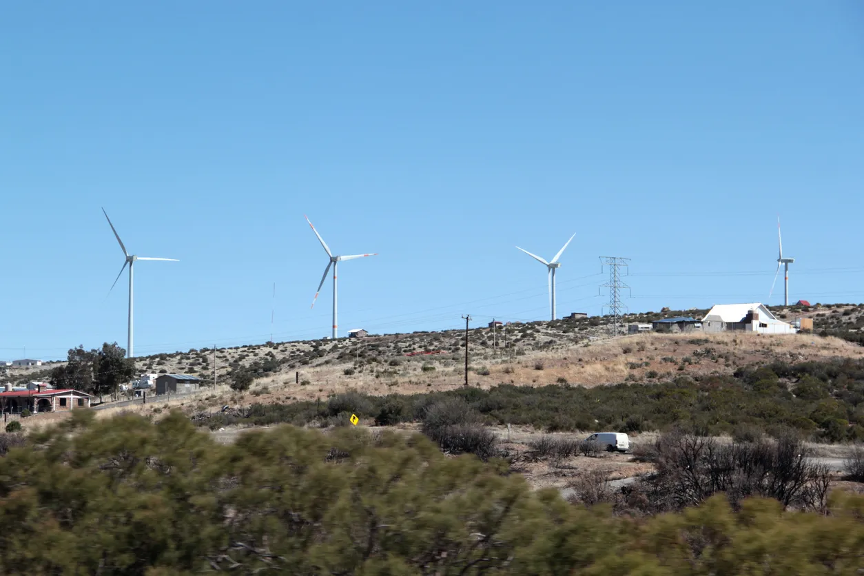 renewable energy infrastructure in Mexico with solar panels and wind turbines near Mexico City Monterrey and Oaxaca