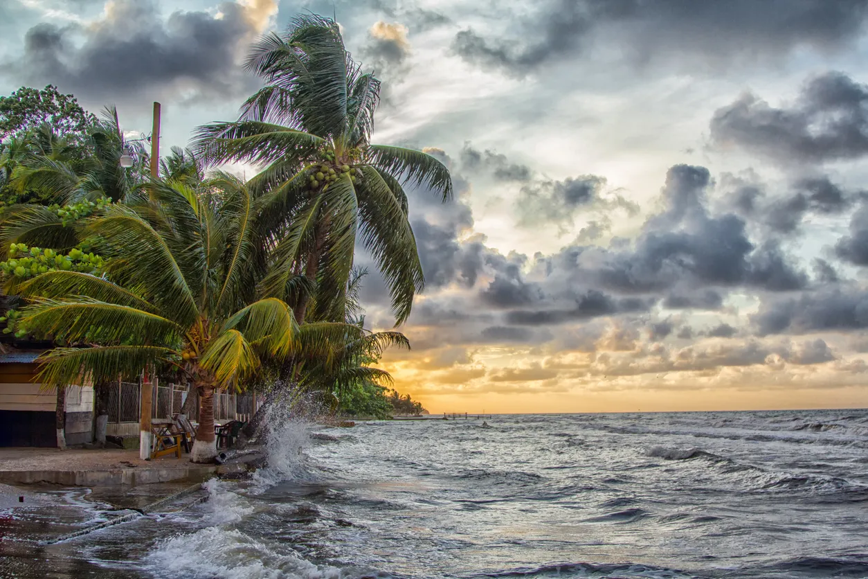Panoramic Caribbean map with connected islands and business leadership silhouettes representing the regional talent and leadership gap.