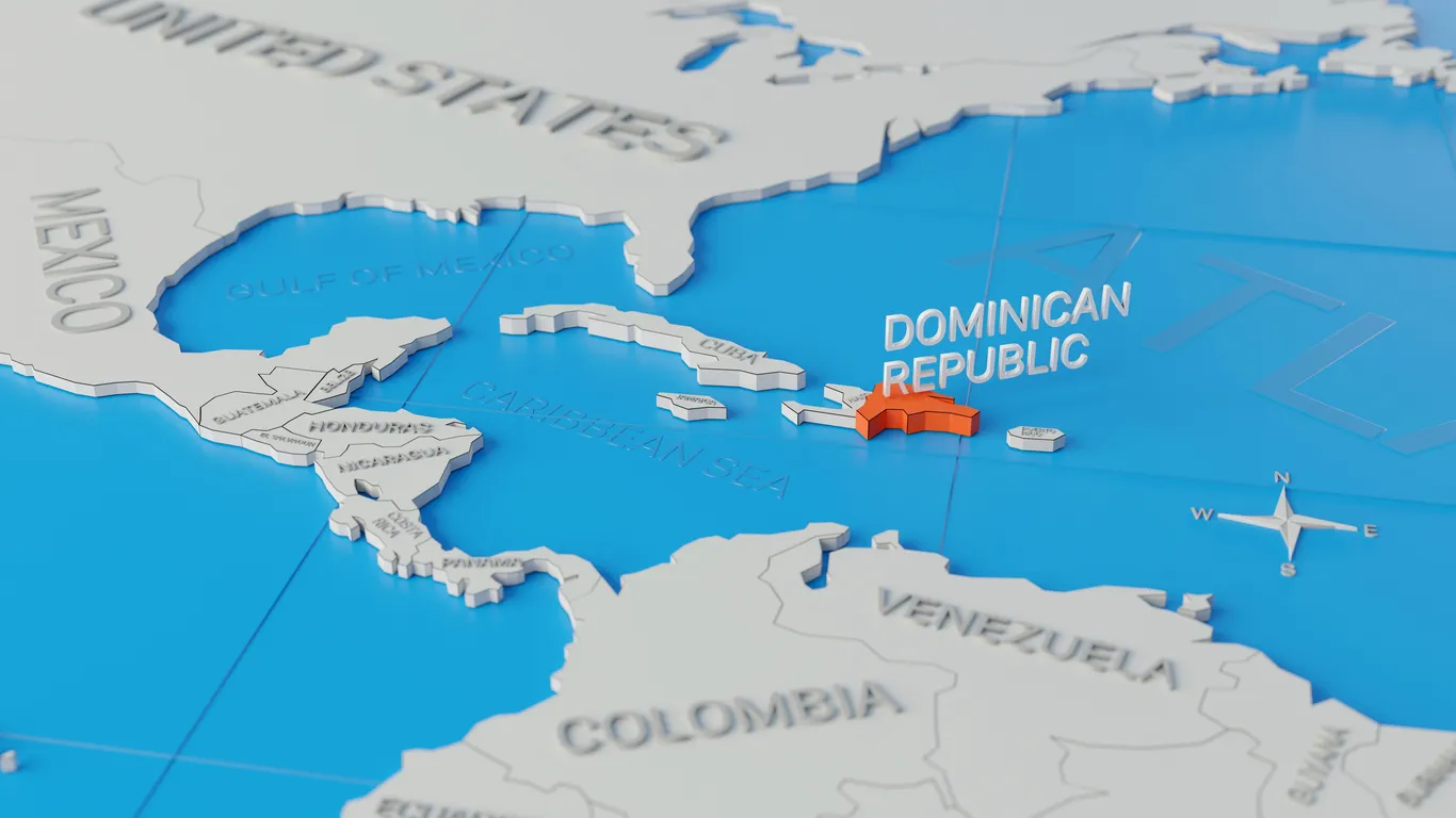 Business leaders reviewing regional strategy maps representing talent mobility and executive hiring across Caribbean islands|
